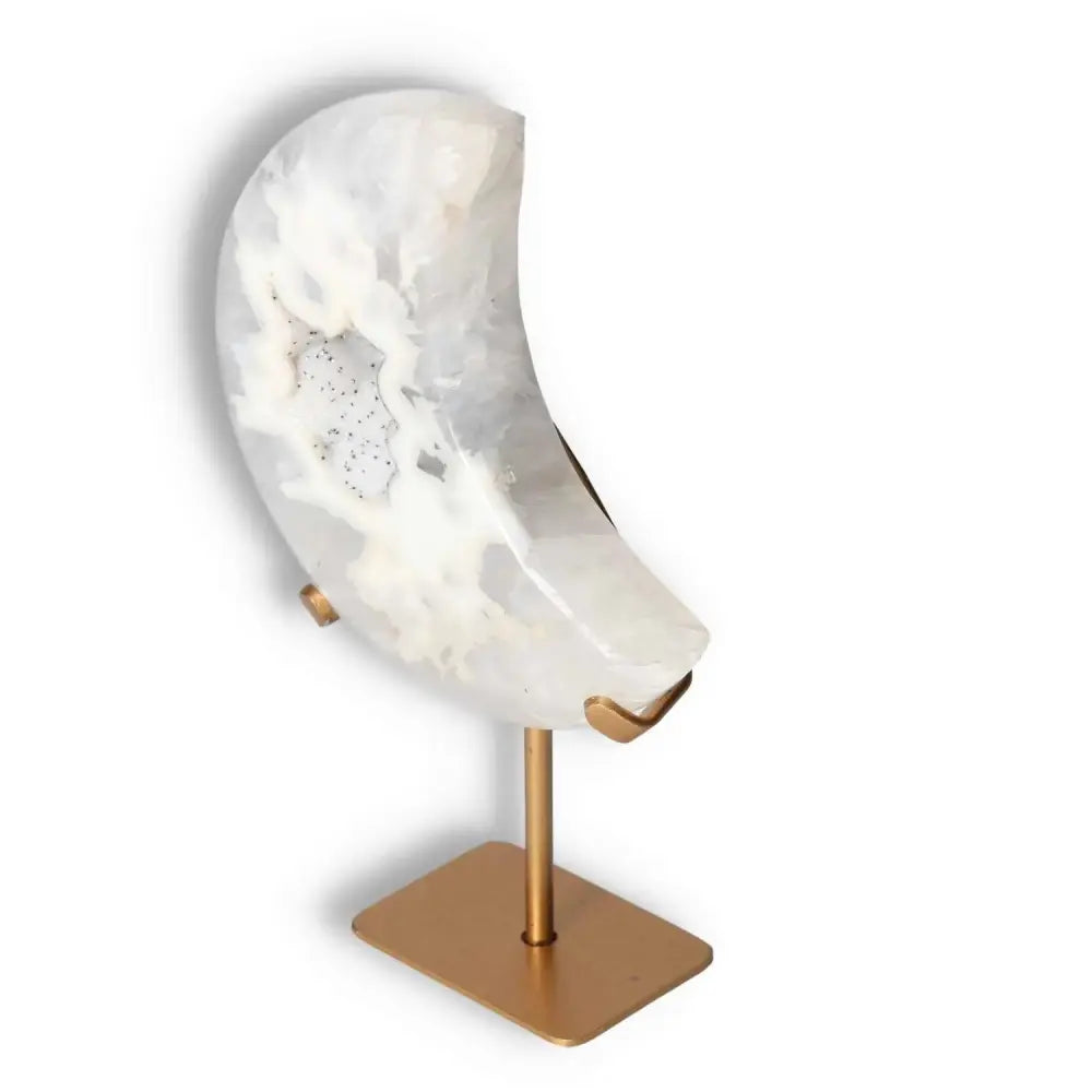 Agate Lunar Crescent on stand, showcasing translucent layers with natural geode formation, ideal for elegant home decor.