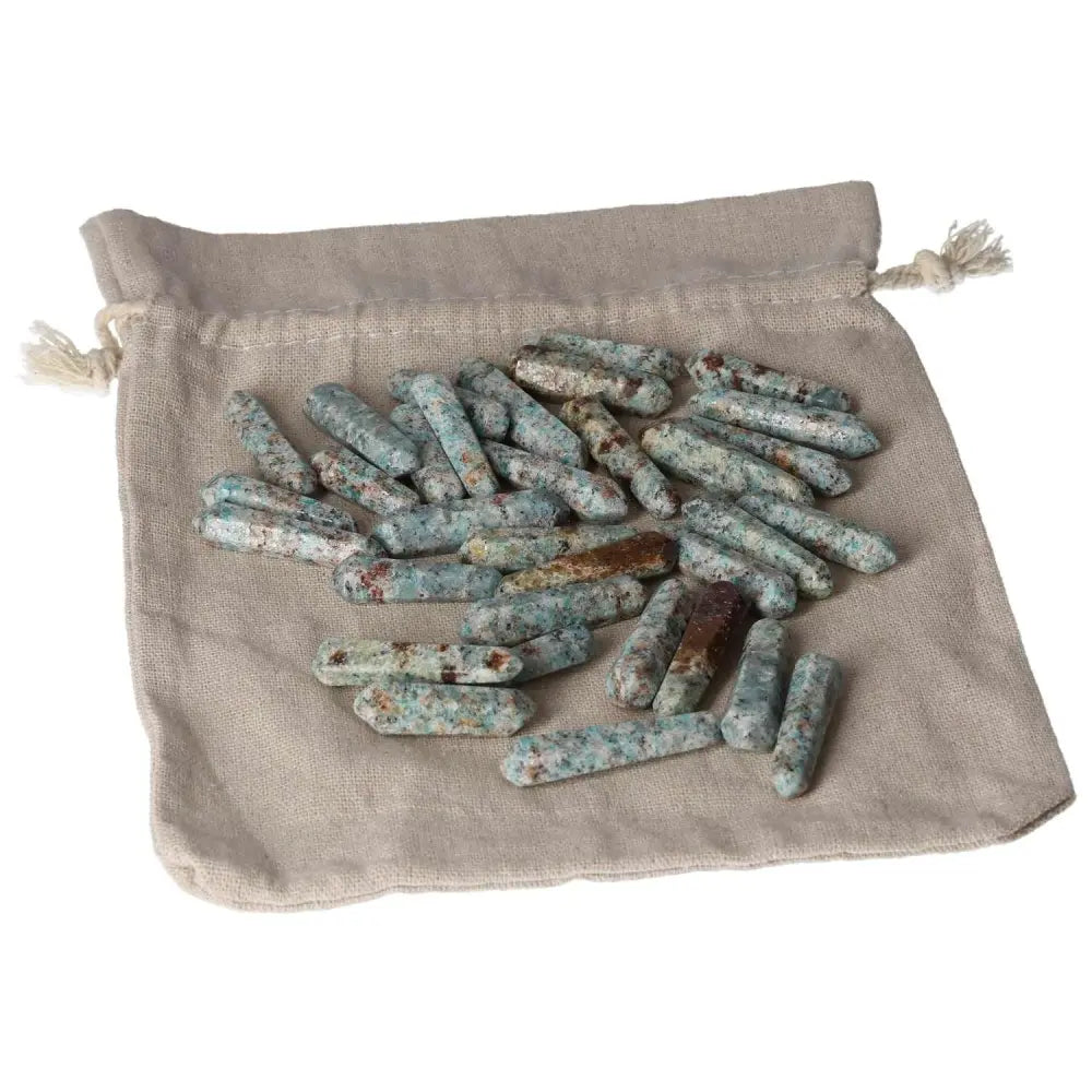 Amazonite small sticks on a beige cloth bag, offering harmony and emotional balance, perfect for calming and releasing fear.