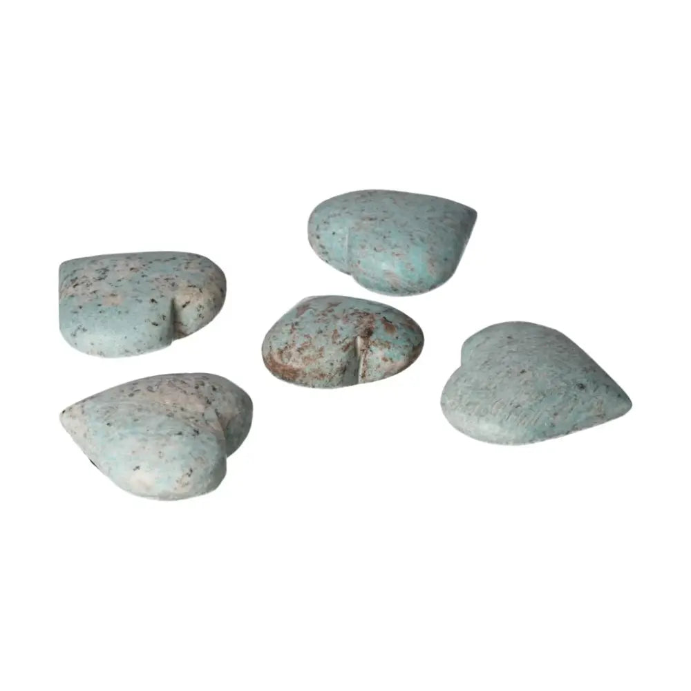 Five heart-shaped Amazonite stones showcasing unique turquoise patterns for emotional balance and clear communication.