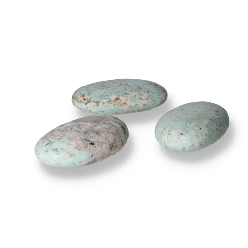 Amazonite palm stones showcasing calming turquoise and green shades, known for promoting emotional balance and inner connection.