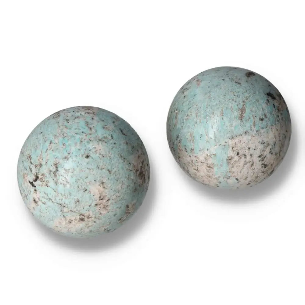 Amazonite spheres with calming turquoise and green tones, promoting emotional balance and clear communication.