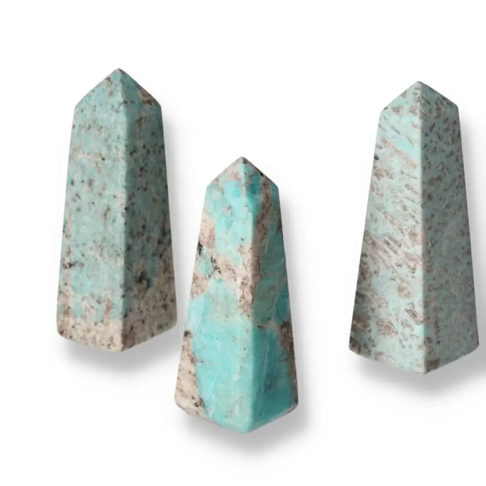 Amazonite tower gemstones with soothing turquoise and green shades, known for promoting emotional balance and clear communication.