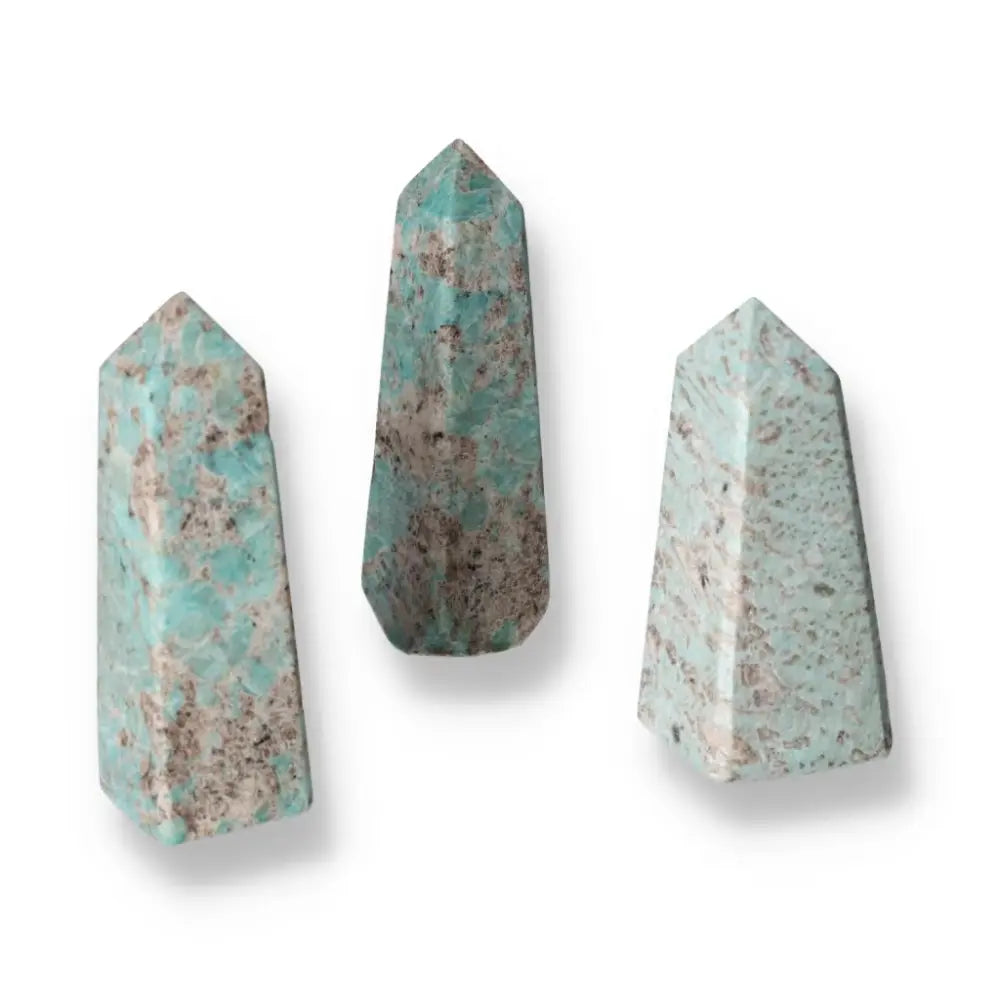 Amazonite tower XL gemstones displaying soothing turquoise and green shades, known for promoting emotional balance and inner connection.