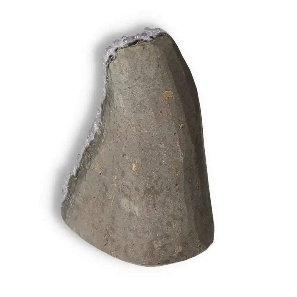 Amethyst Cut Base Geode from Sylvia Crystals, showcasing its raw and natural exterior, perfect for enhancing serenity and focus.