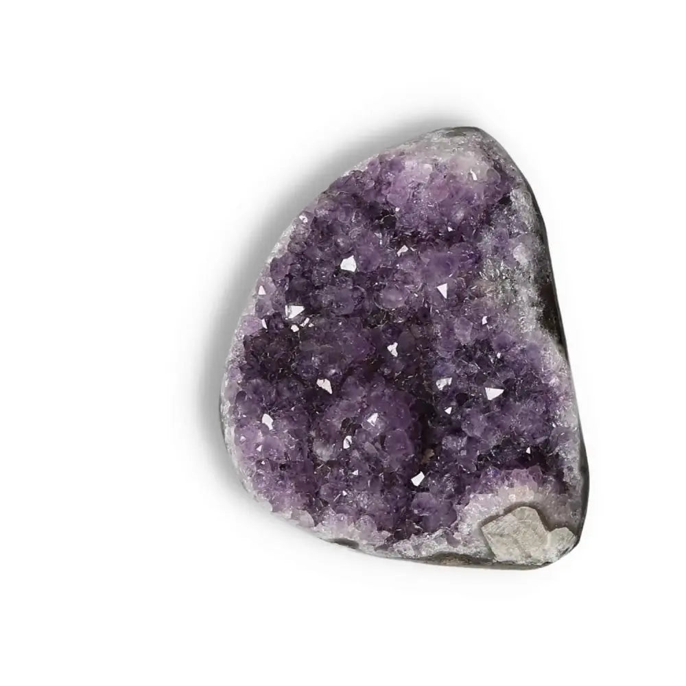 Amethyst Cut Base Geode with deep purple crystals, known for stress reduction and energy enhancement, from Sylvia Crystals.