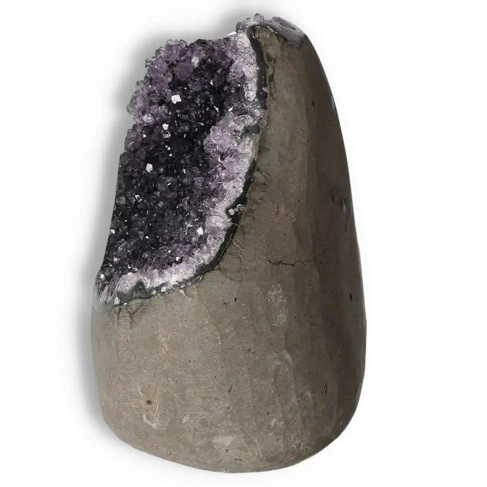 Elegant Amethyst Cut Base Geode with sparkling purple crystals, offered by Sylvia Crystals, enhances energy and emotional stability.