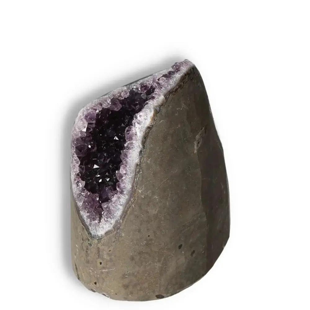 Amethyst Cut Base Geode from Sylvia Crystals; a stunning gemstone known for its calming properties and aesthetic appeal.