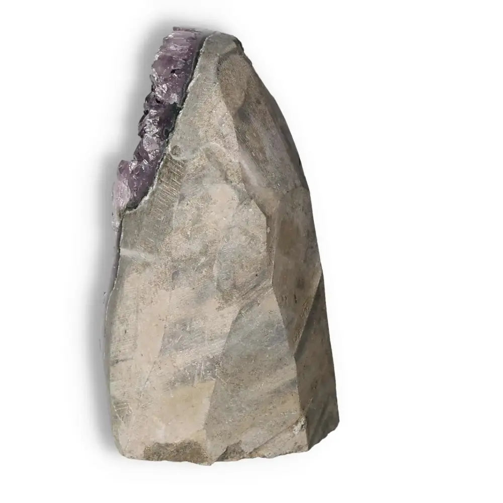 Side view of an Amethyst Cut Base Geode from Sylvia Crystals, showcasing its natural beauty and stress-reducing qualities.