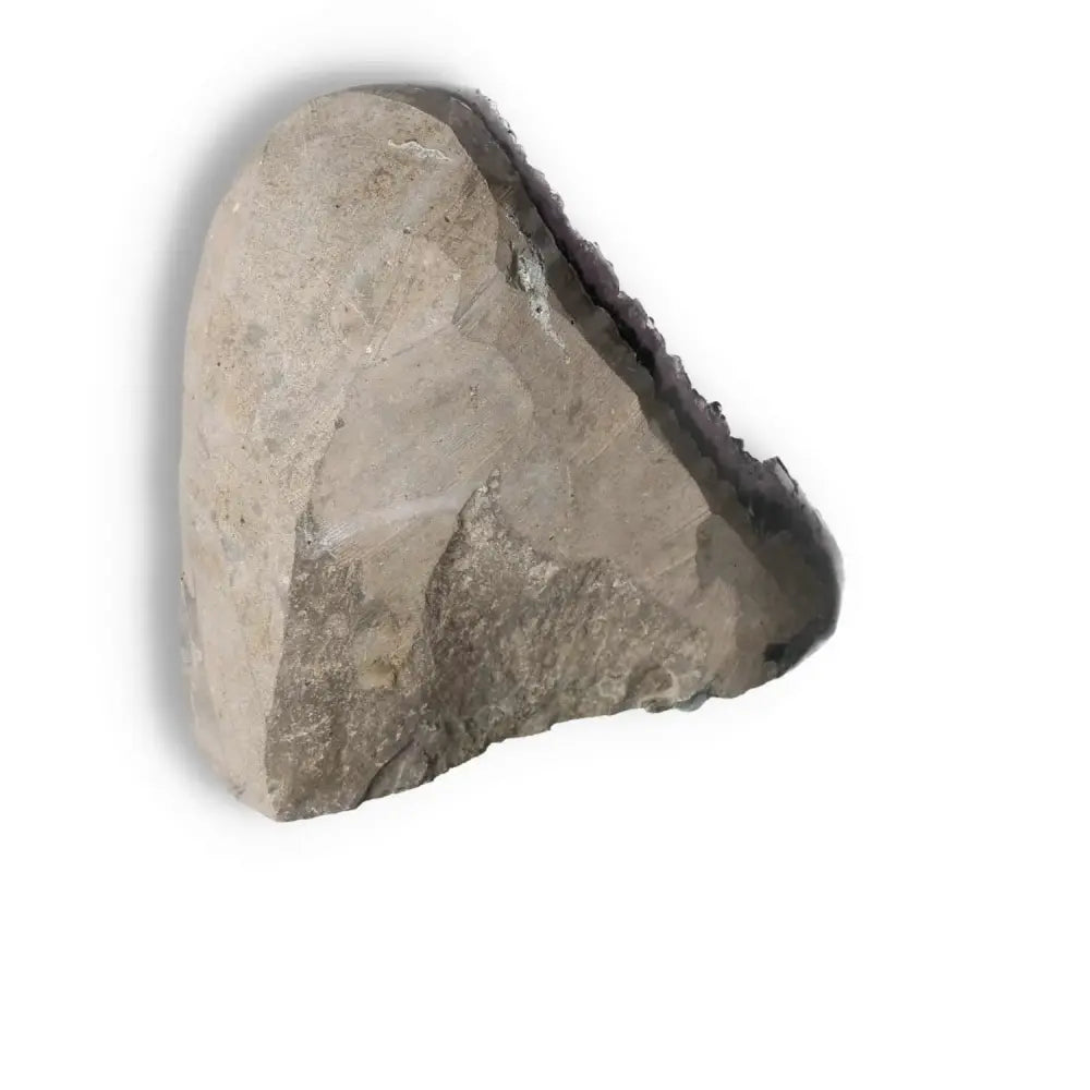 Amethyst Cut Base Geode showcasing raw exterior from Sylvia Crystals, enhancing energy and concentration, luxury decor piece.