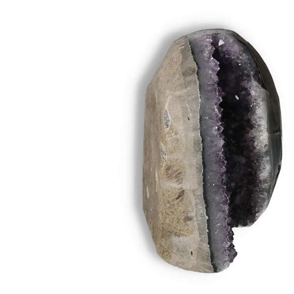 Amethyst Cut Base Geode from Sylvia Crystals showcasing luxury and tranquility with its elegant purple and natural patterns.