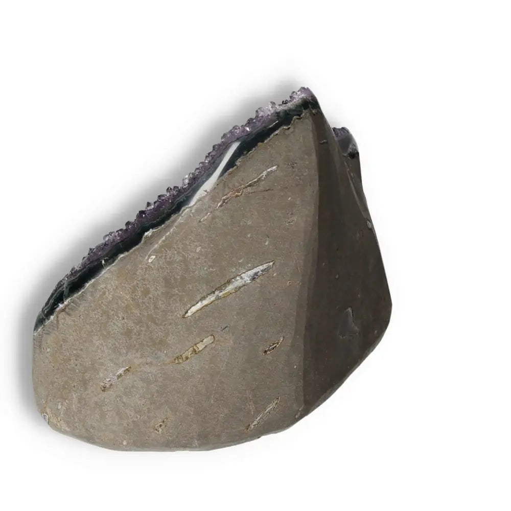 Amethyst Cut Base Geode from Sylvia Crystals, showcasing stress-relieving, energy-enhancing qualities in a luxury stone.