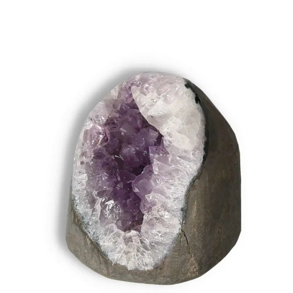 Amethyst Cut Base Geode with vibrant purple hues, available at Sylvia Crystals, enhances concentration and emotional stability.