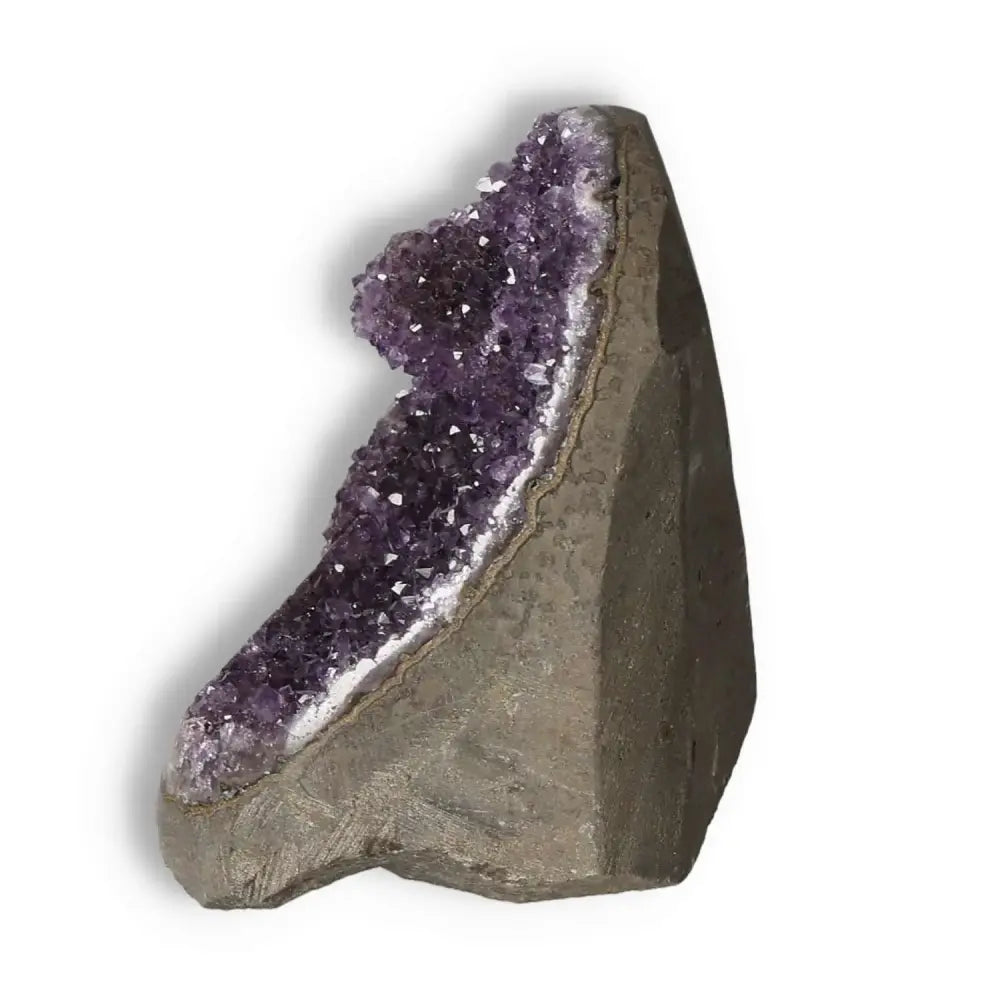 Amethyst Cut Base Geode from Sylvia Crystals, showcasing purple crystals and a rough exterior, known for luxury and stress relief.