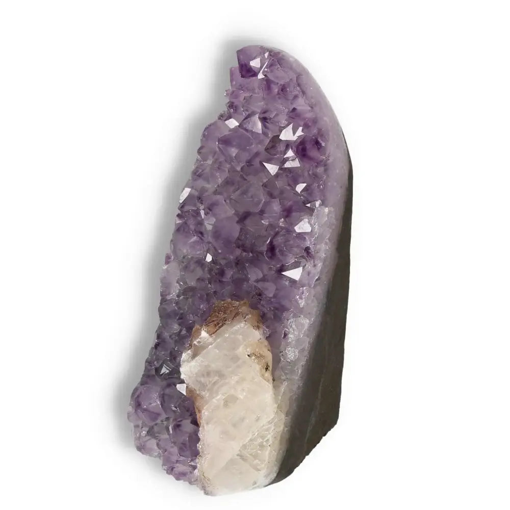 Amethyst Cut Base Geode by Sylvia Crystals, showcasing its elegant purple hues and crystal structure, enhancing tranquility and concentration.