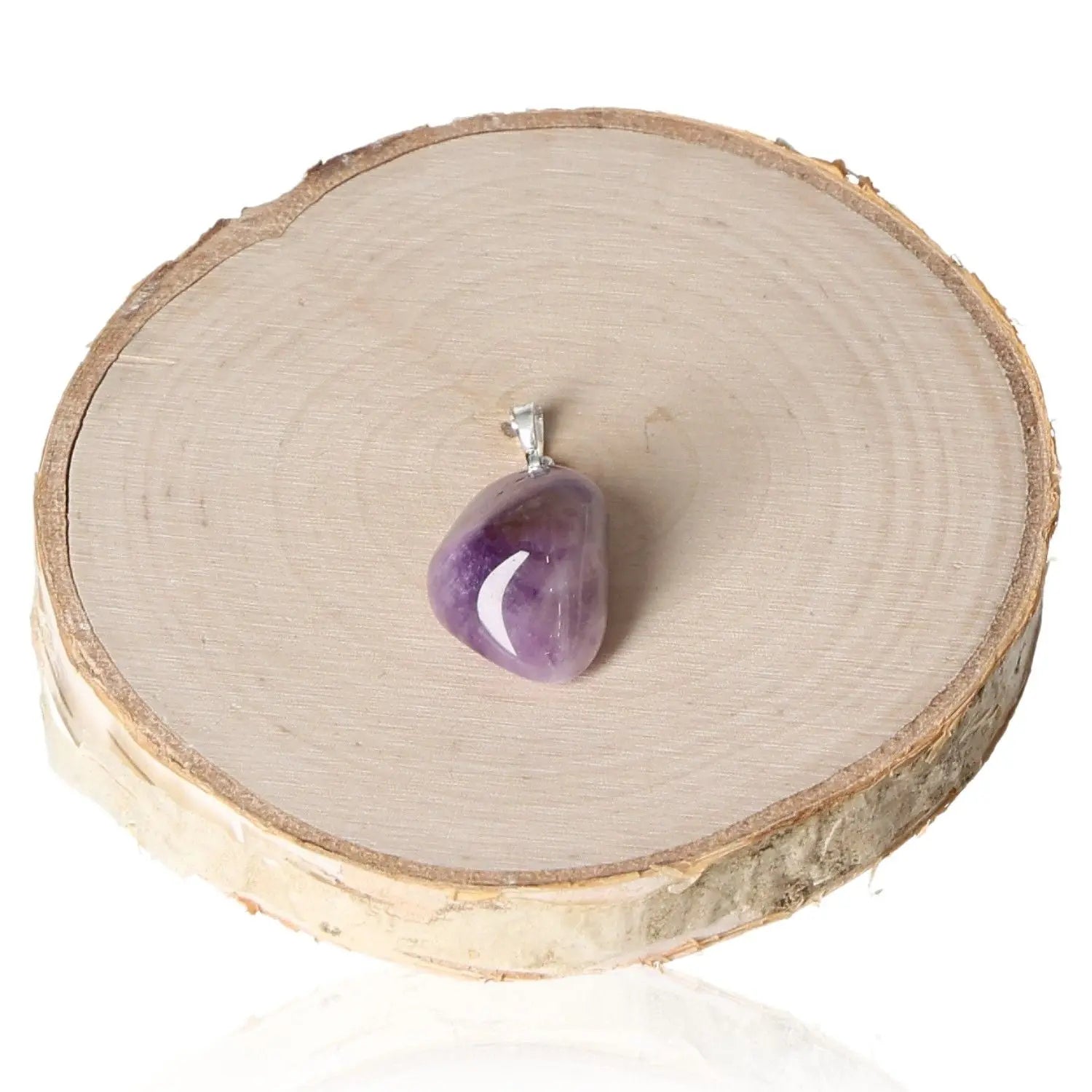 Amethyst Lavender Malawi Tumbled Pendant on wooden display, showcasing unique lavender hues and organic design for elegance and mystique.