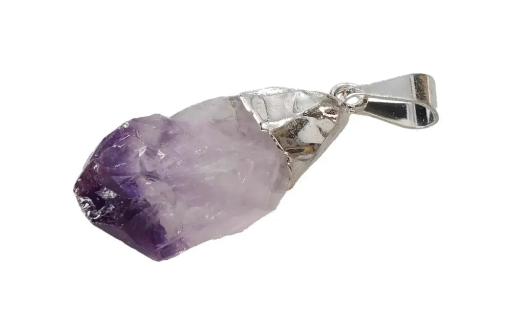 Elegant small amethyst point pendant with silver setting, ideal for crystal jewelry lovers.
