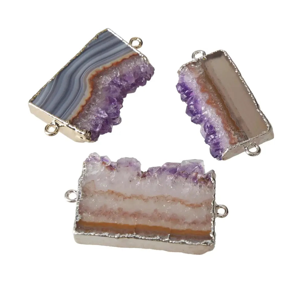Three rectangular amethyst slice connectors, showcasing vibrant purple hues and natural crystal patterns with metal loops for jewelry making.