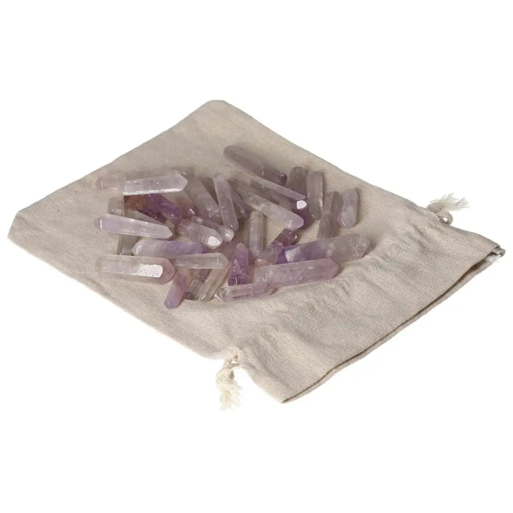 Amethyst small sticks on cloth bag, ideal for stress reduction, energy boost, and enhancing concentration and emotional stability.