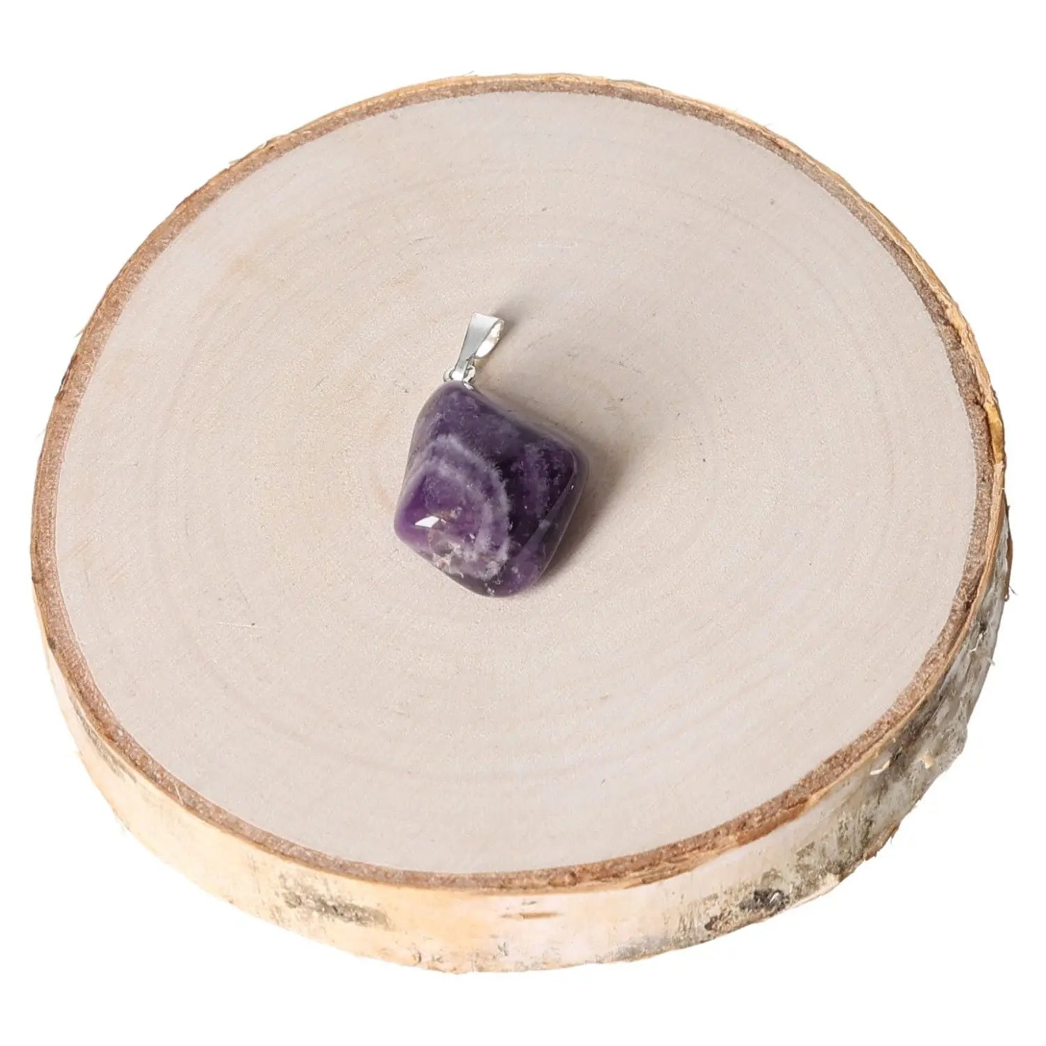 Amethyst Zebra Tumbled Pendant with unique purple and white patterns displayed on a wooden surface, showcasing elegance and mystique.