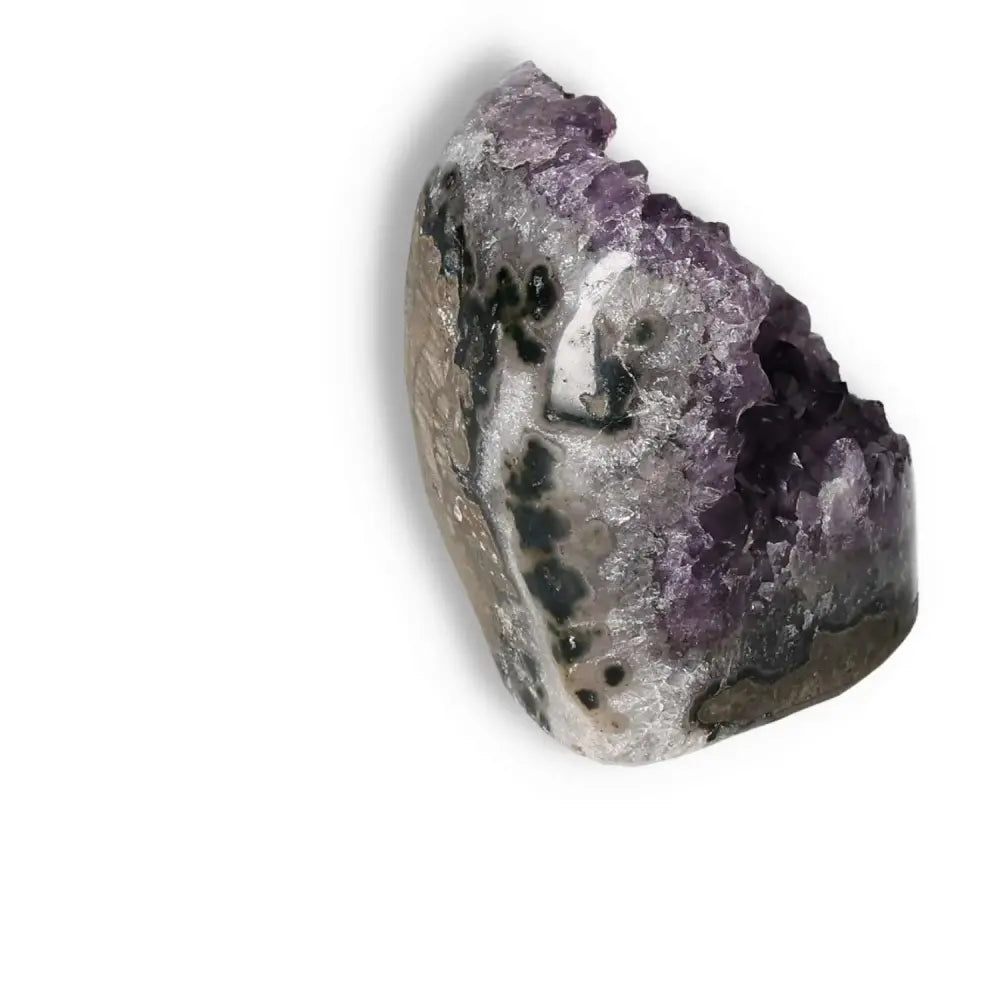 Amethyst cut base geode from Sylvia Crystals, showcasing deep purple hues and natural patterns for stress reduction and concentration enhancement.