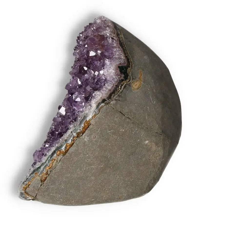 Amethyst cut base geode displaying vibrant violet crystals from Sylvia Crystals, ideal for decor and stress relief.