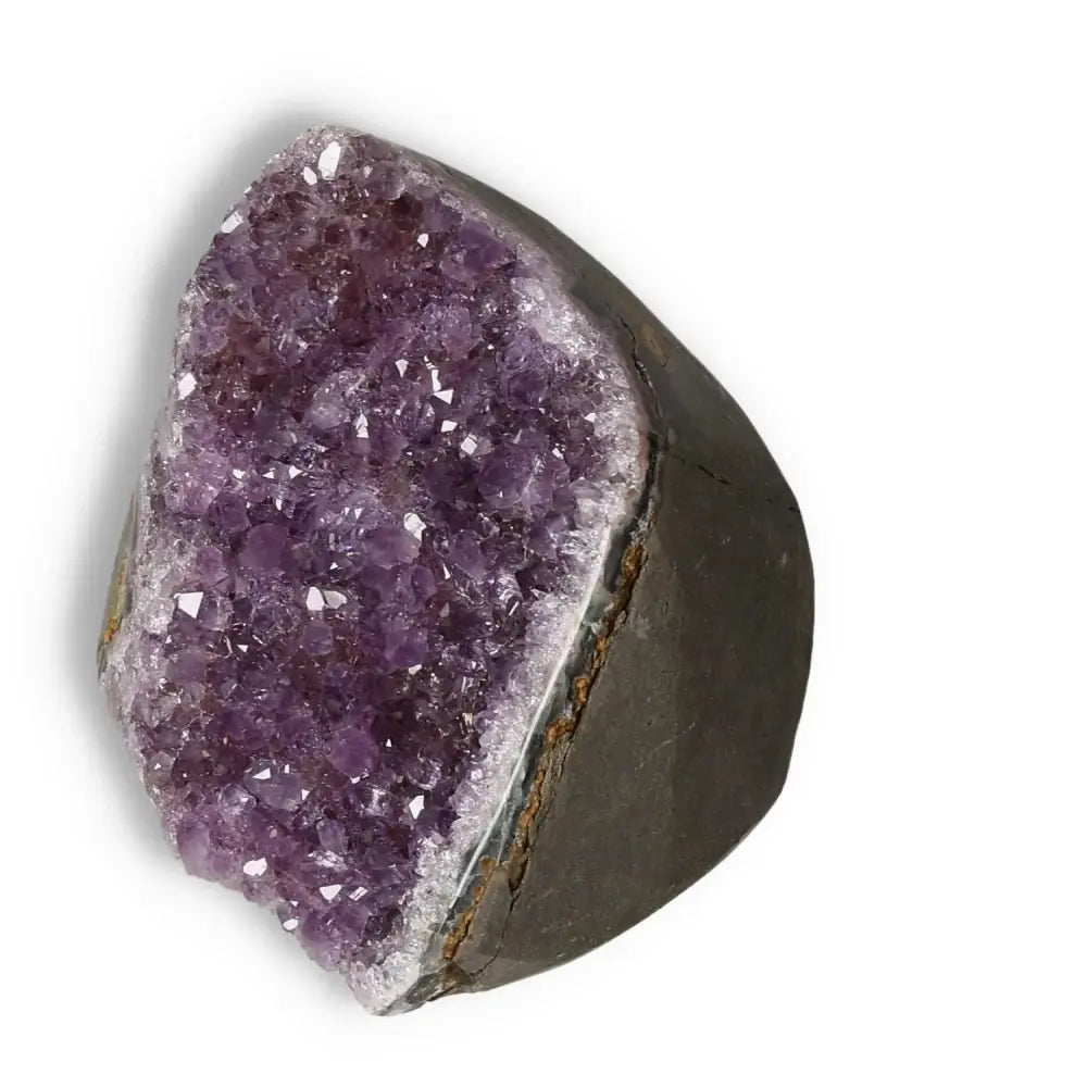 Amethyst cut base geode with violet hues from Sylvia Crystals, ideal for decoration and enhancing emotional stability.