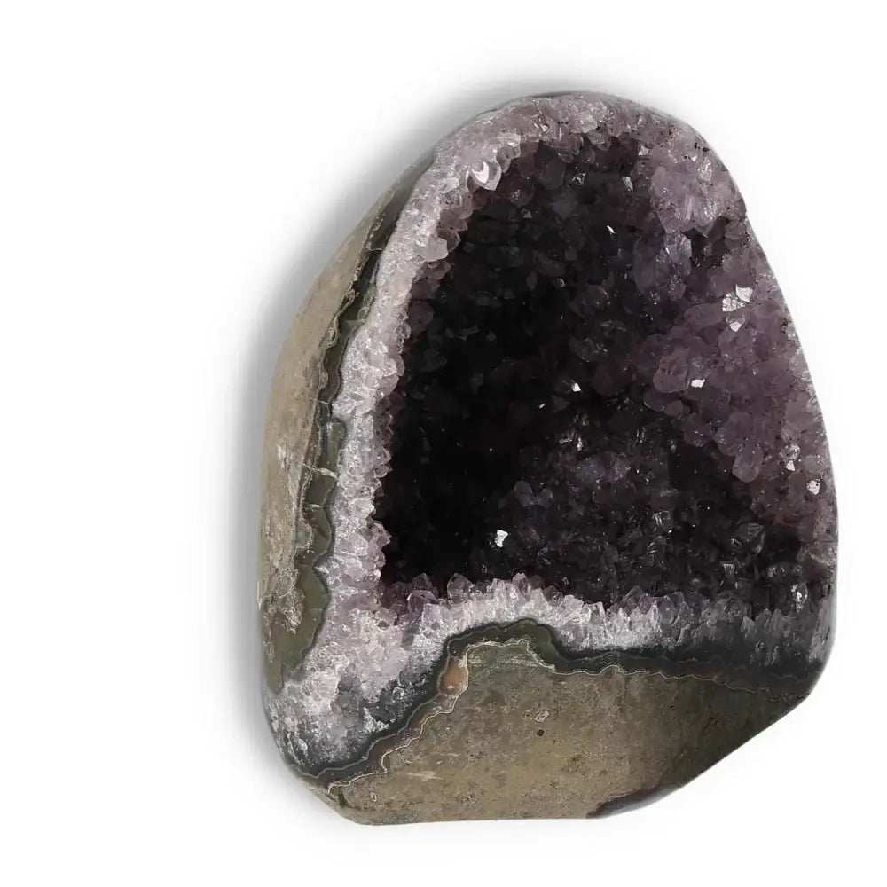 Amethyst cut base geode showcasing deep purple crystals and a natural stone exterior, offered by Sylvia Crystals for spiritual energy.