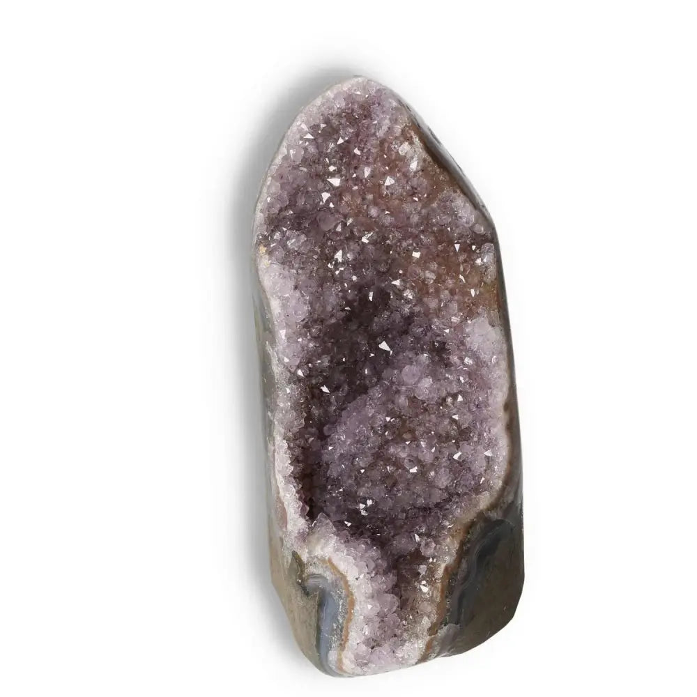 Amethyst cut base geode from Sylvia Crystals, showcasing natural energy properties and elegant design to enhance concentration and stability.