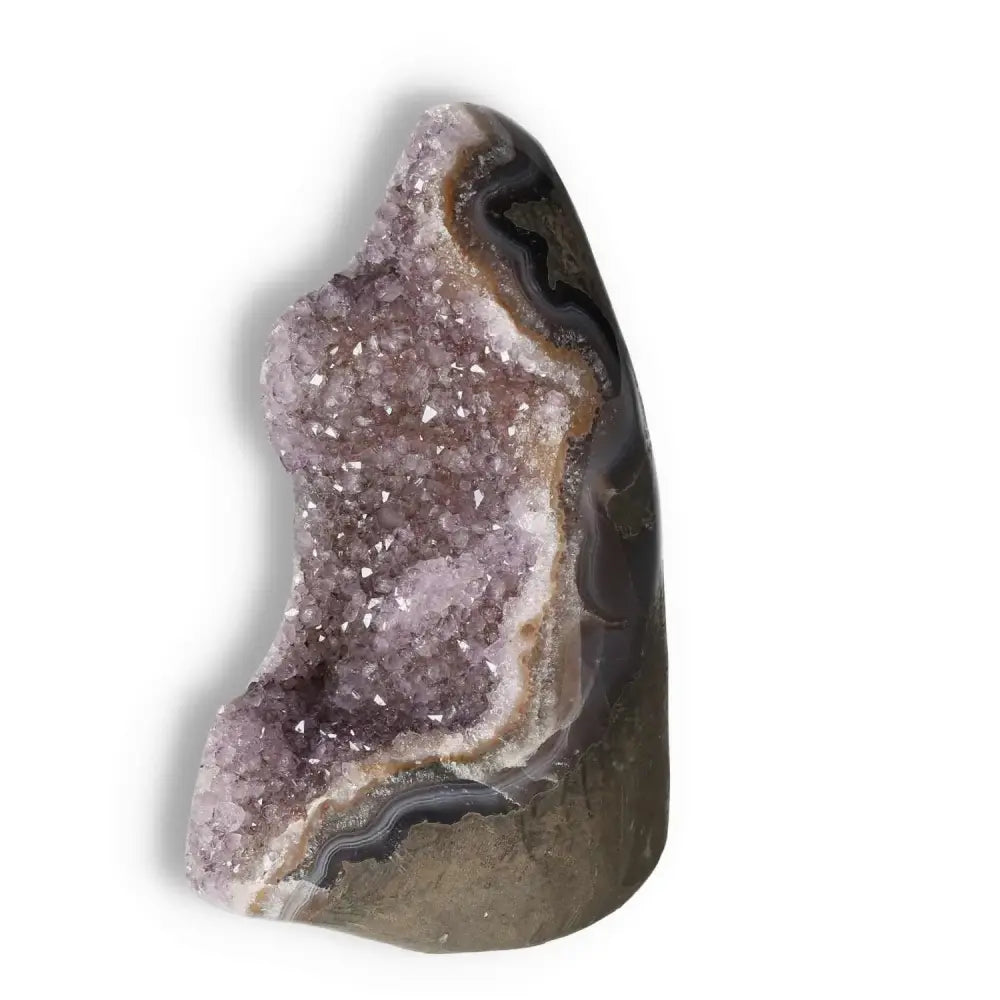 Amethyst cut base geode from Sylvia Crystals showcasing sparkling crystals and natural patterns, ideal for energy boosting and decor.