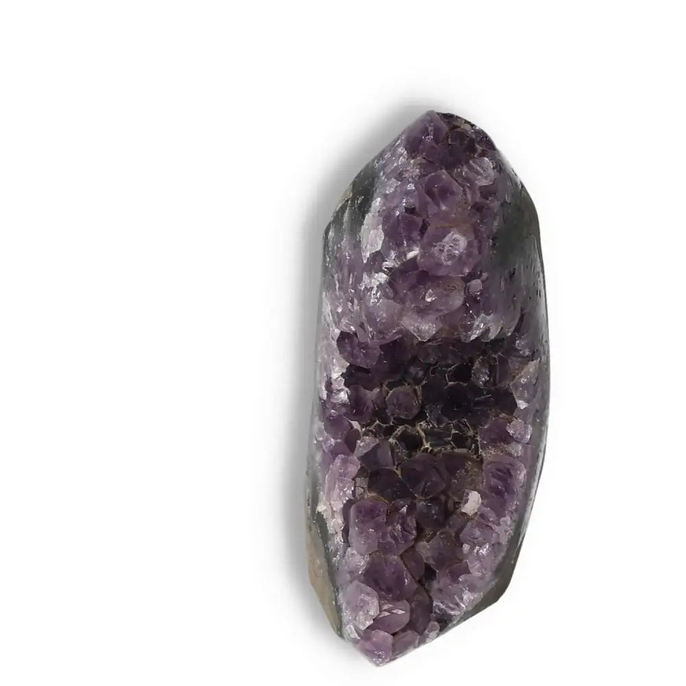 Amethyst cut base geode from Sylvia Crystals, showcasing vibrant purple hues and natural elegance for tranquility and spiritual rejuvenation.