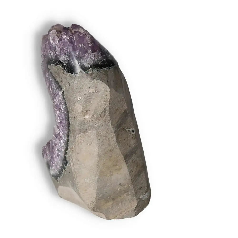 Amethyst cut base geode showcasing intricate purple crystal formations from Sylvia Crystals, known for tranquility and spiritual rejuvenation.