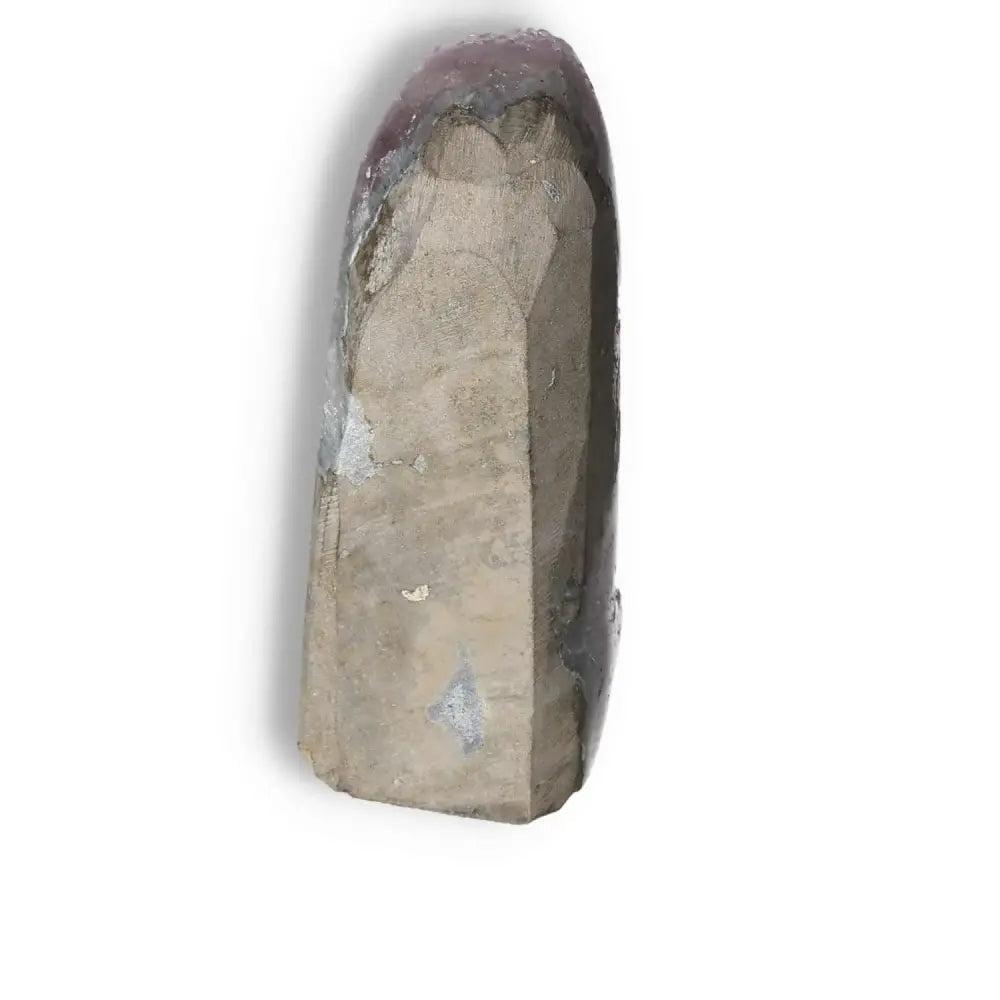 Amethyst cut base geode from Sylvia Crystals showcasing deep purple tones, promoting calmness and focus.