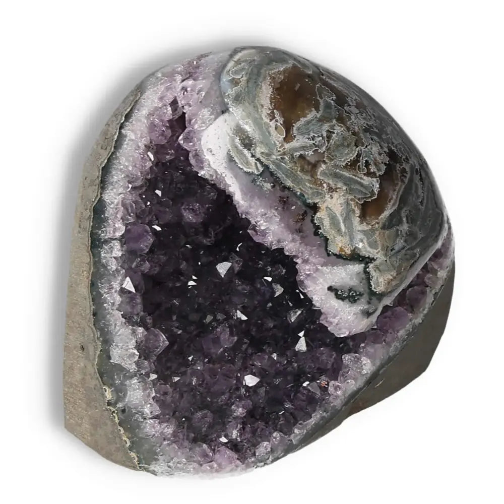 Amethyst cut base geode with deep purple crystals by Sylvia Crystals, ideal for decor and stress reduction.