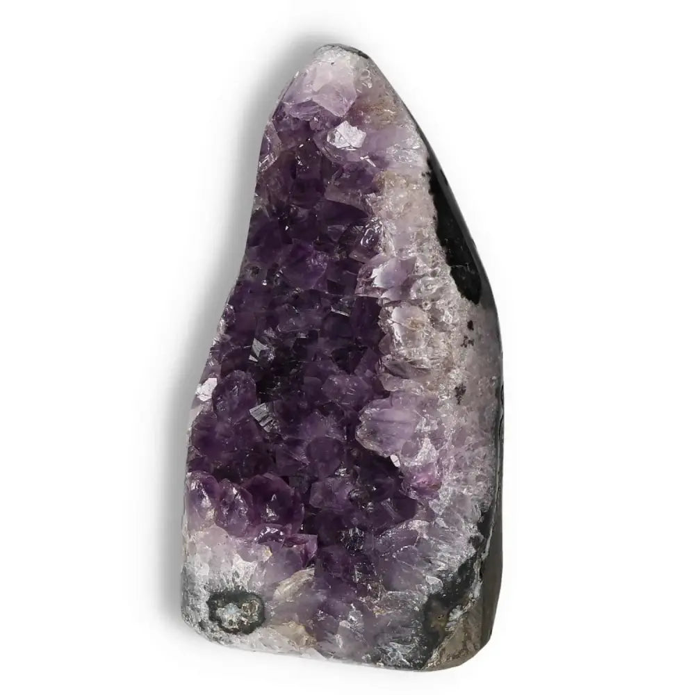 Amethyst cut base geode showcasing deep purple crystals, sourced from Sylvia Crystals, known for enhancing well-being and spiritual serenity.