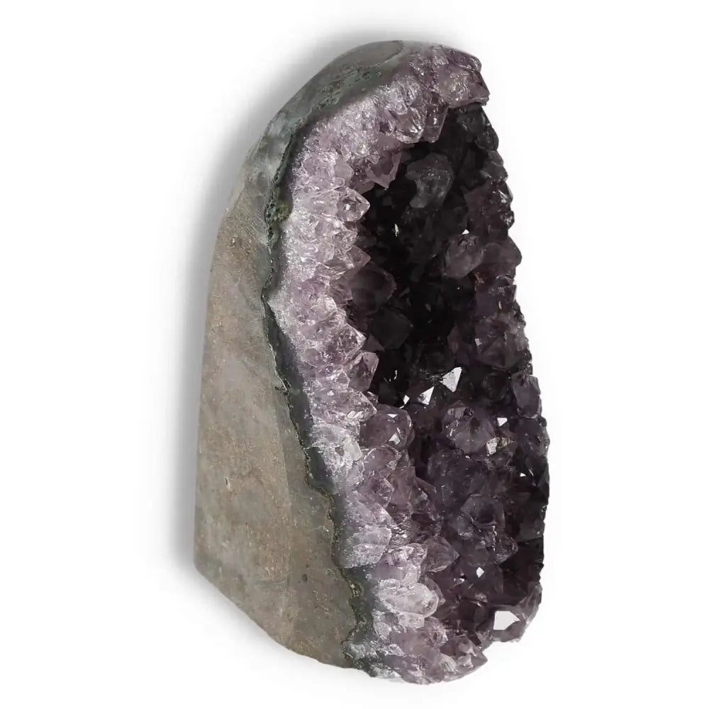 Amethyst cut base geode from Sylvia Crystals, showcasing deep purple crystals. Enhances emotional stability and concentration.