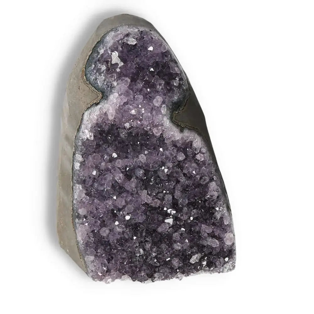 Amethyst cut base geode by Sylvia Crystals, enhancing luxury and spiritual essence with natural beauty and metaphysical properties.