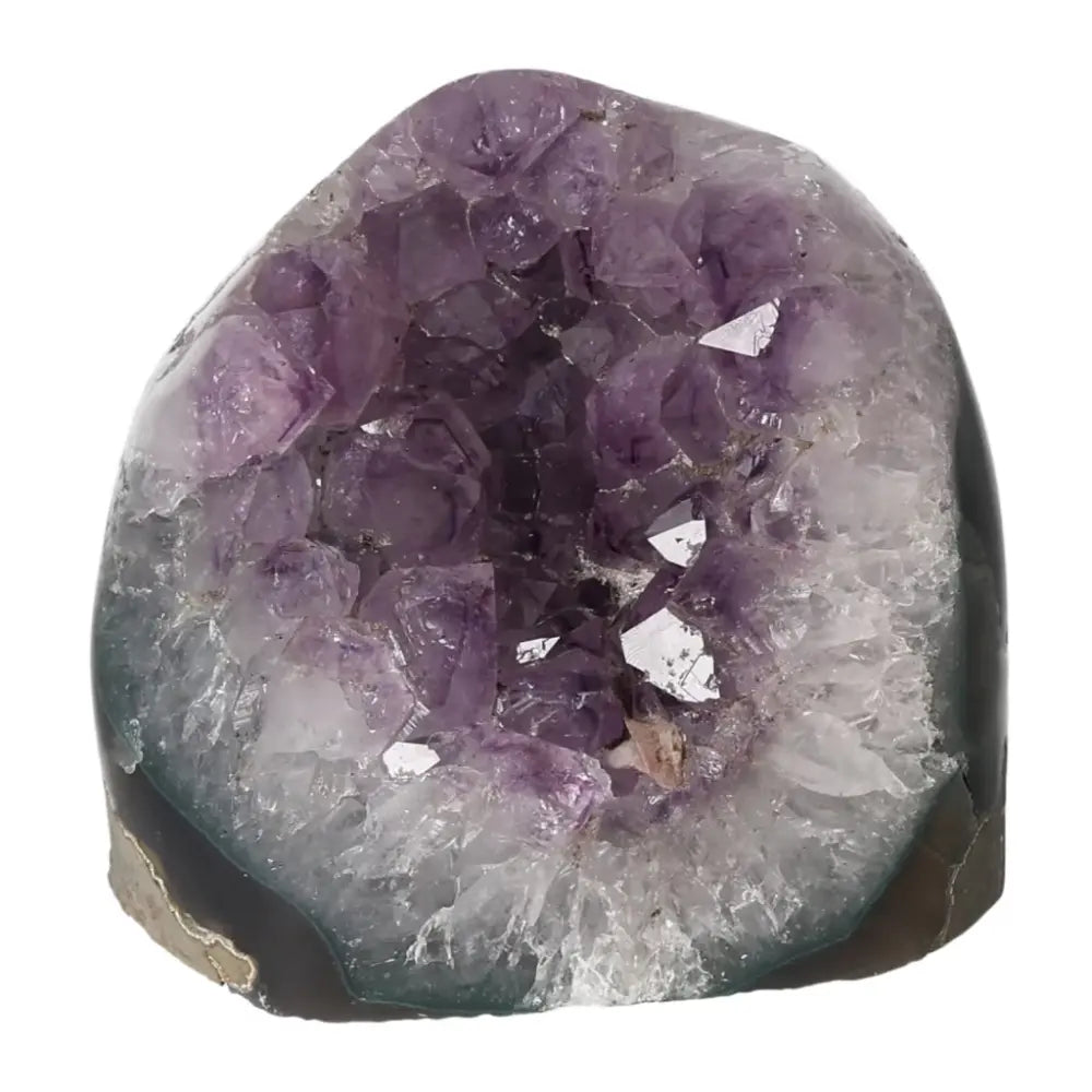 Amethyst cut base geode from Sylvia Crystals, showcasing superior quality and elegance. Enhance energy and reduce stress with this unique piece.