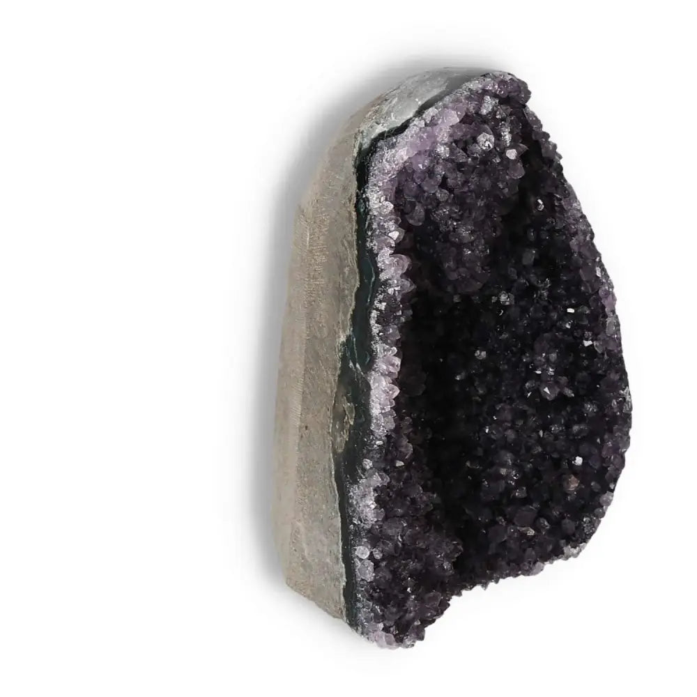 Amethyst cut base geode from Sylvia Crystals, showcasing vibrant purple hues and premium craftsmanship for tranquility and mental clarity.