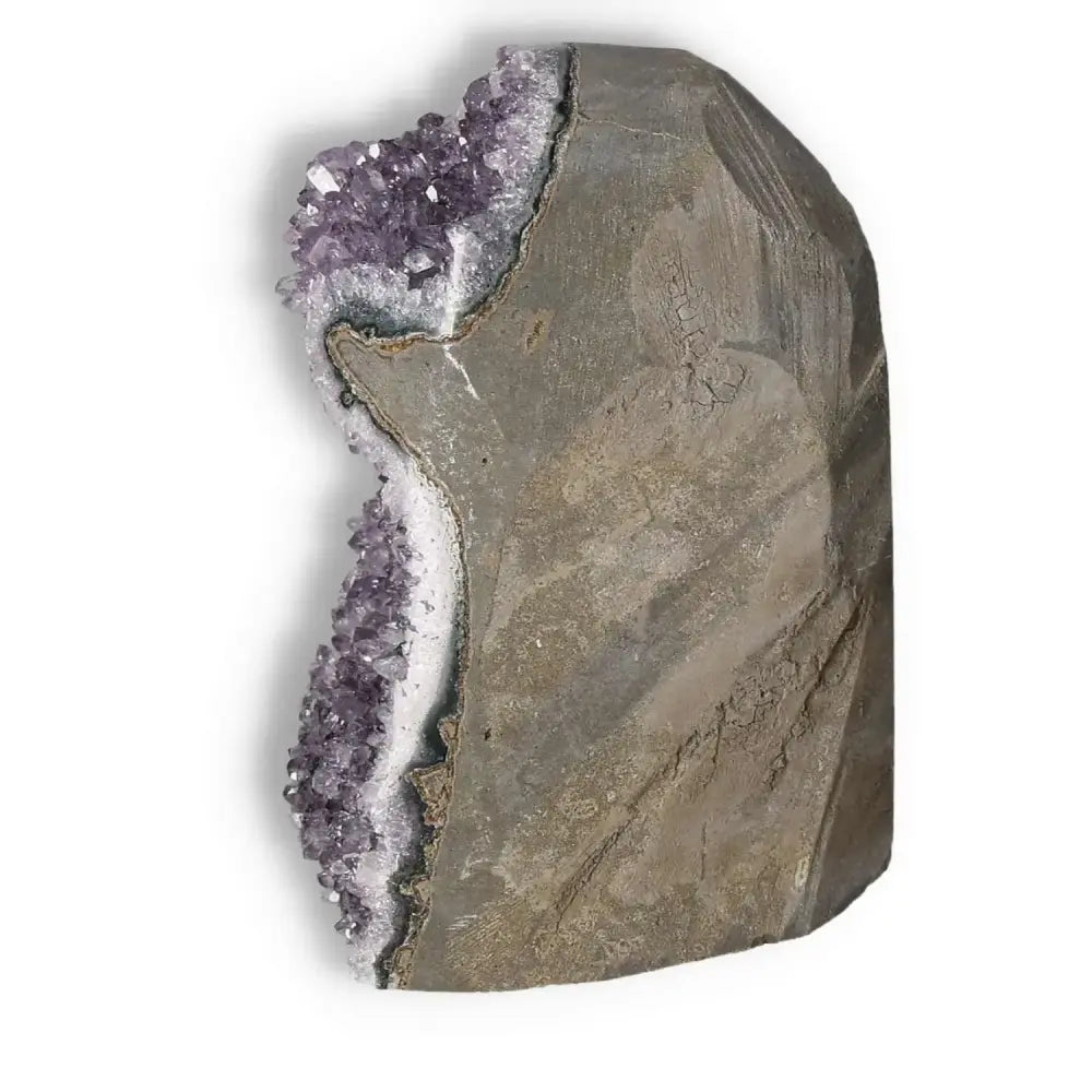 Luxury Amethyst cut base geode with purple crystals, renowned for its stress reduction, from Sylvia Crystals.