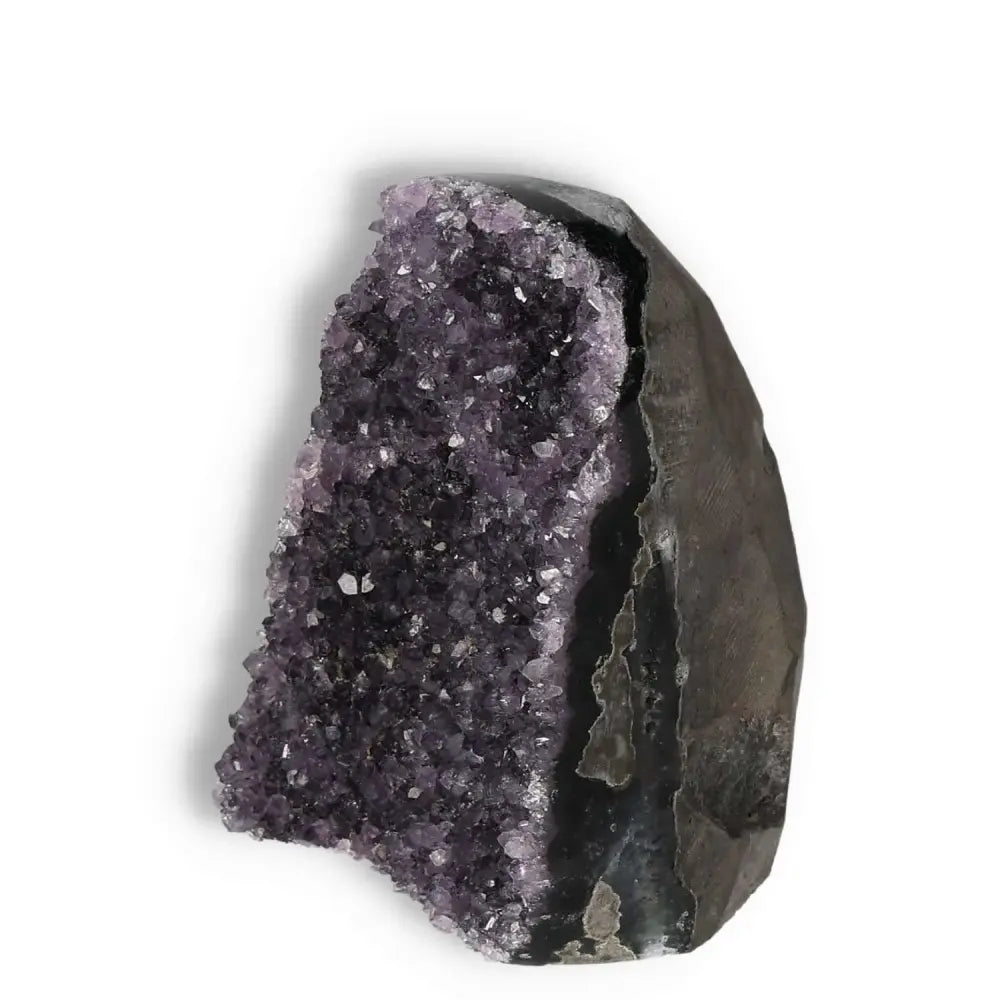 Amethyst cut base geode from Sylvia Crystals, showcasing vibrant purple hues and natural textures for luxury and spiritual wellness.
