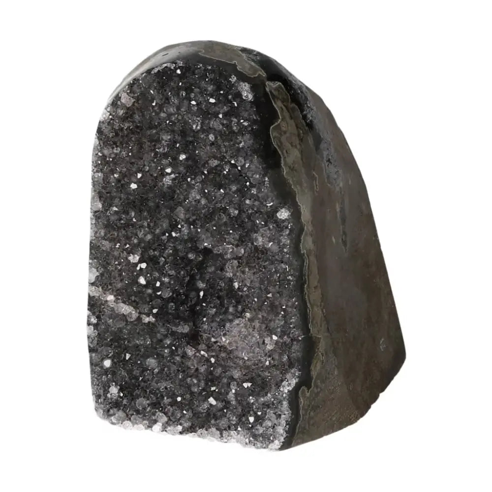 Amethyst geode with cut base, showcasing sparkling crystals, enhancing tranquility and energy. A Sylvia Crystals luxury masterpiece.