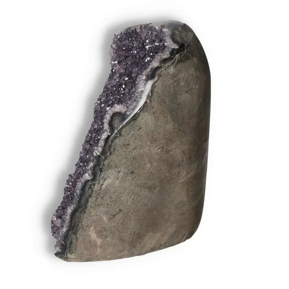 Amethyst cut base geode with deep purple crystals, premium selection from Sylvia Crystals, offering spiritual elegance and natural beauty.