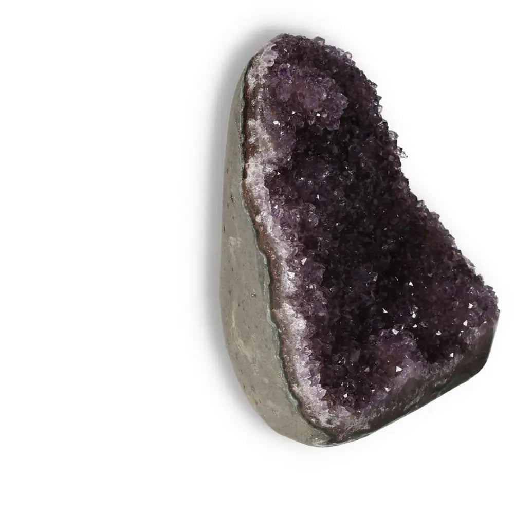 Amethyst cut base geode from Sylvia Crystals, showcasing vibrant purple crystals, perfect as a luxurious spiritual centerpiece.