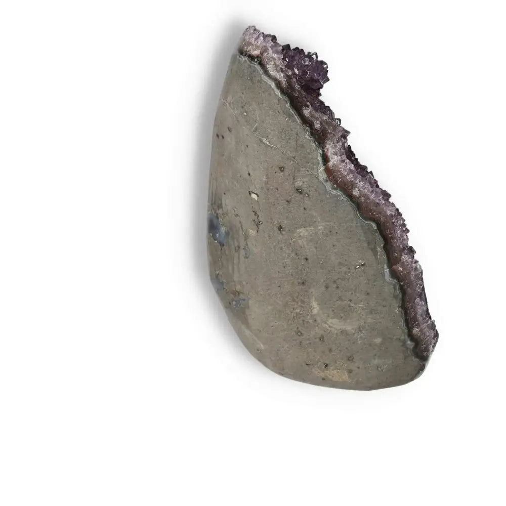 Amethyst cut base geode from Sylvia Crystals showcasing purple crystals, offering spiritual harmony and luxury.