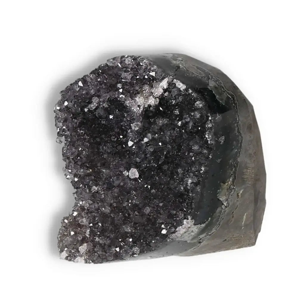 Amethyst cut base geode from Sylvia Crystals, enhancing decor and well-being, known for stress reduction and focus improvement.