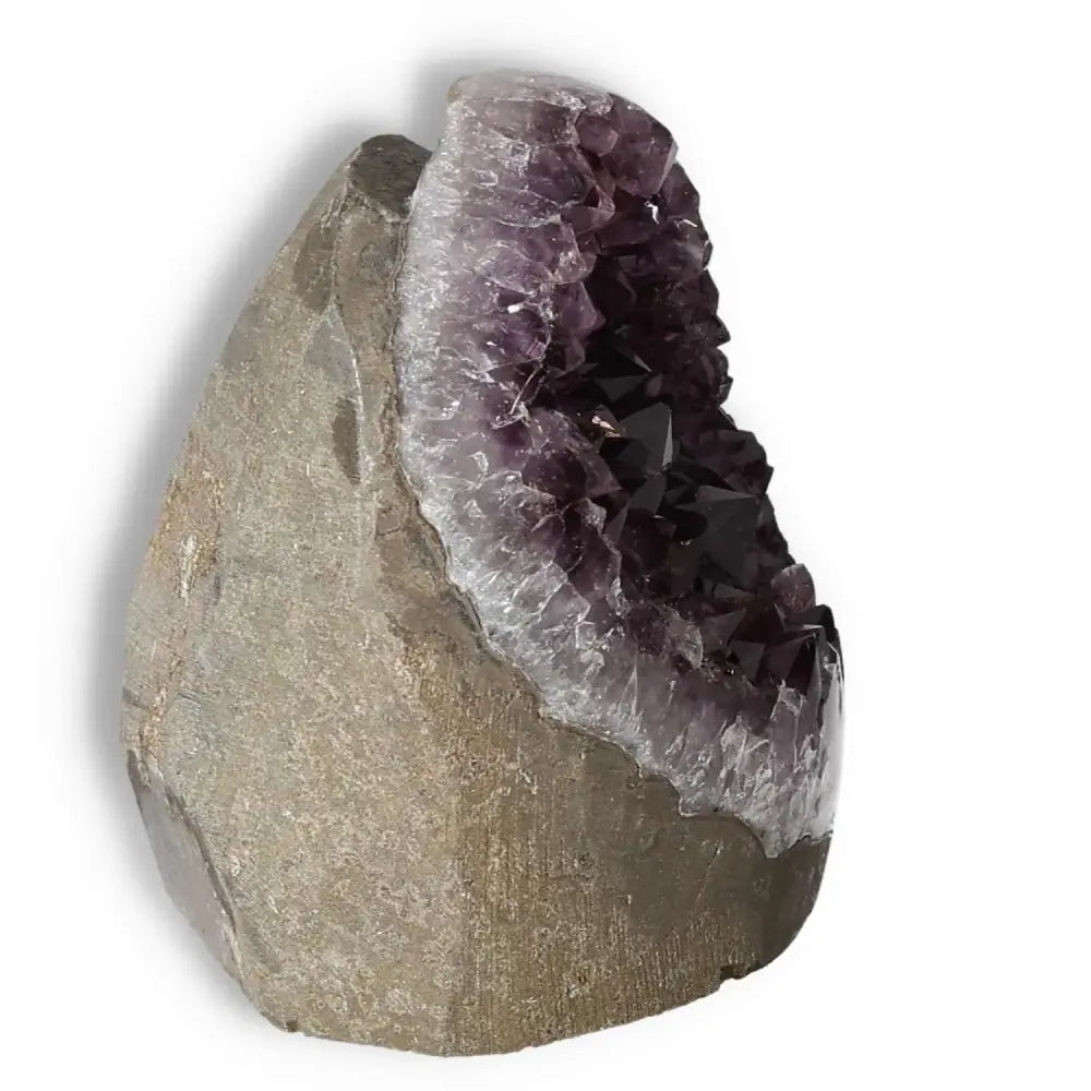 Amethyst cut base geode by Sylvia Crystals showcasing deep purple crystals enhancing emotional stability and concentration.