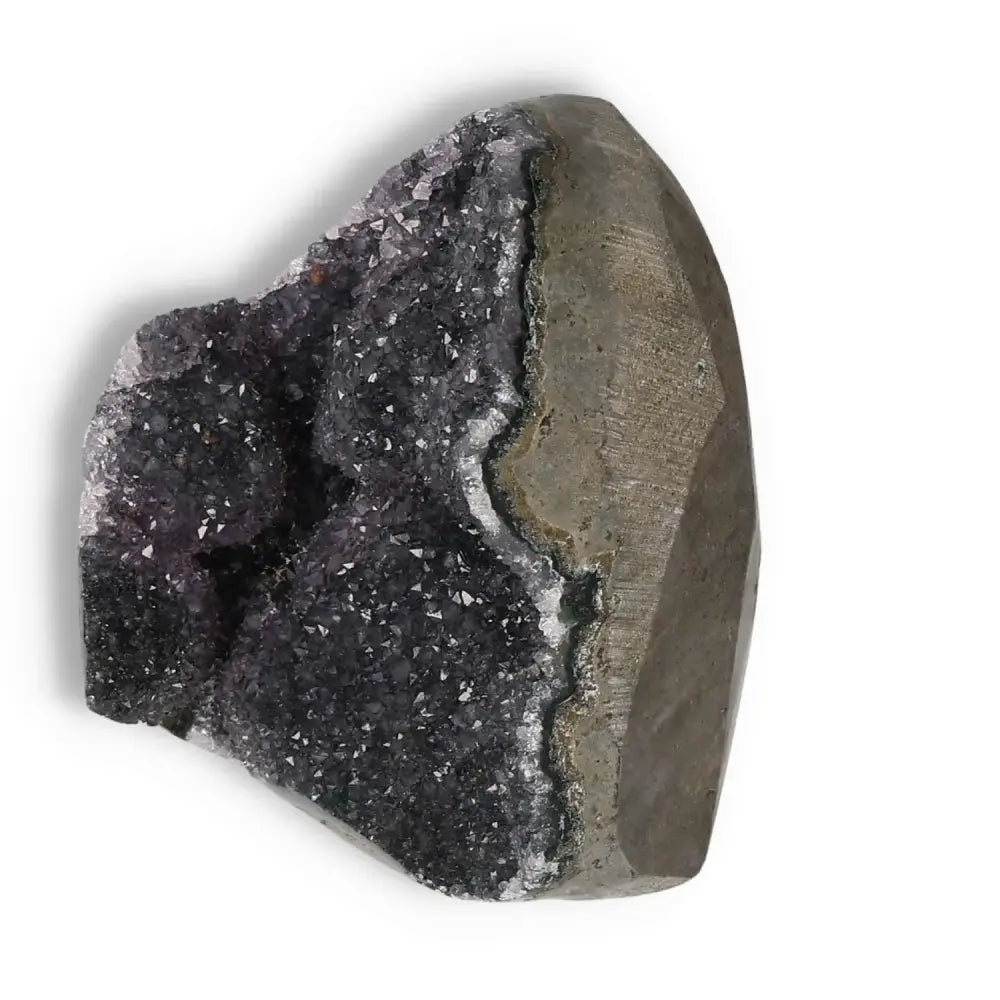 Amethyst cut base geode from Sylvia Crystals, reduces stress, boosts energy, enhances concentration, promoting tranquility.