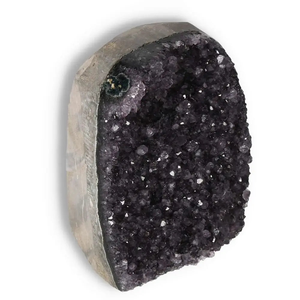 Amethyst cut base geode from Sylvia Crystals, showcasing deep purple hues and crystalline elegance for home decor and spiritual wellness.