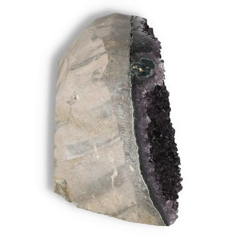 Amethyst cut base geode from Sylvia Crystals, showcasing deep purple hues and rugged texture, ideal for decor and spiritual enhancement.