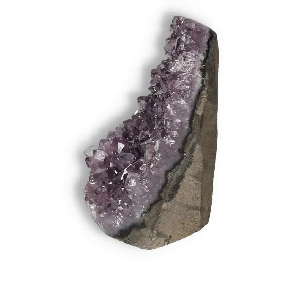 Amethyst cut base geode with deep purple crystals from Sylvia Crystals, showcasing natural beauty and tranquility.